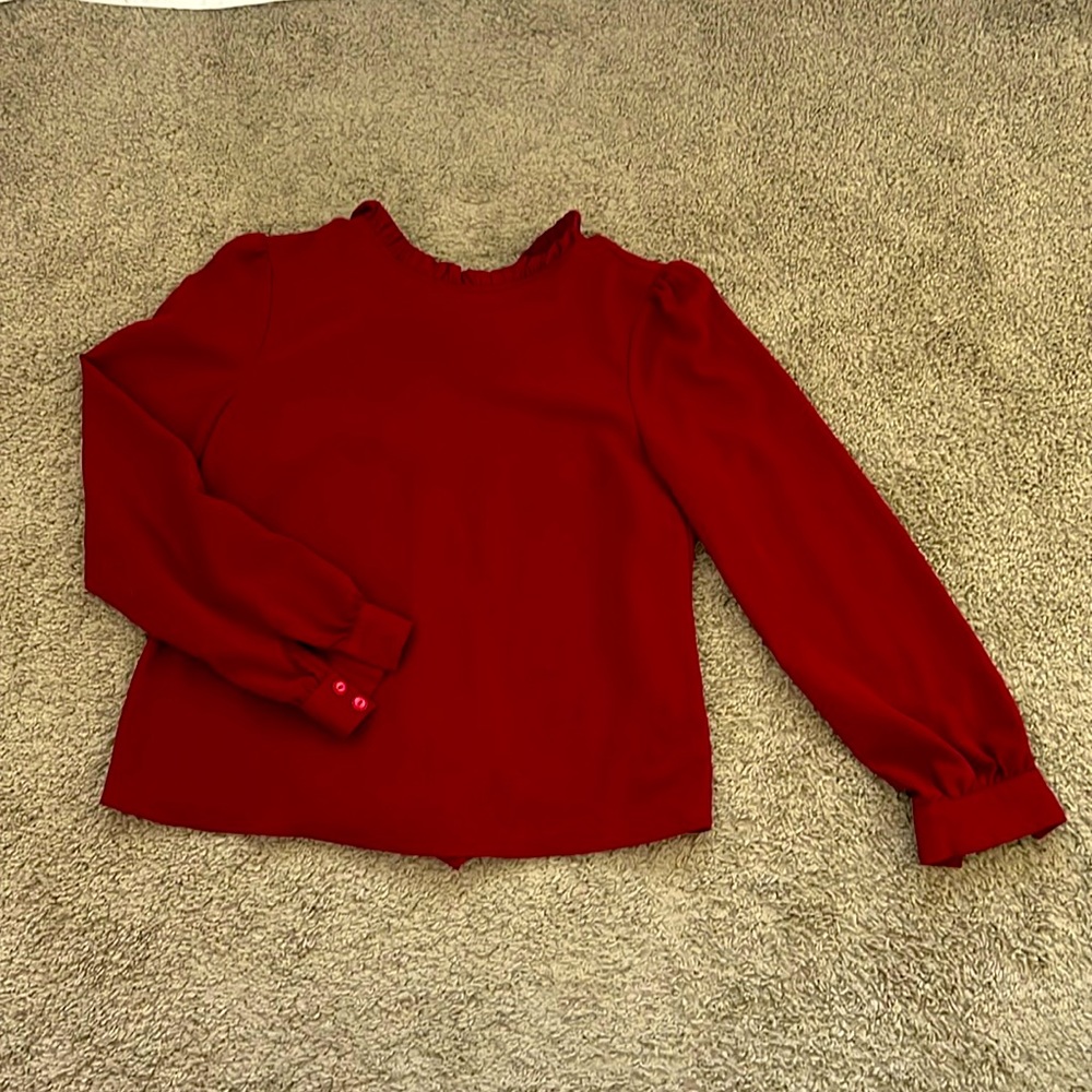 Red high neck blouse with long tie in back. Size 6.